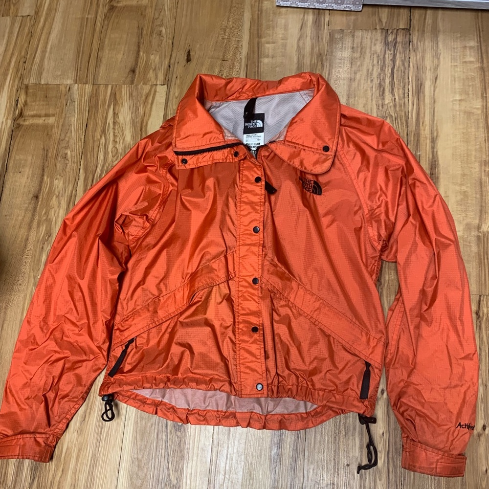 Orange north face windbreaker